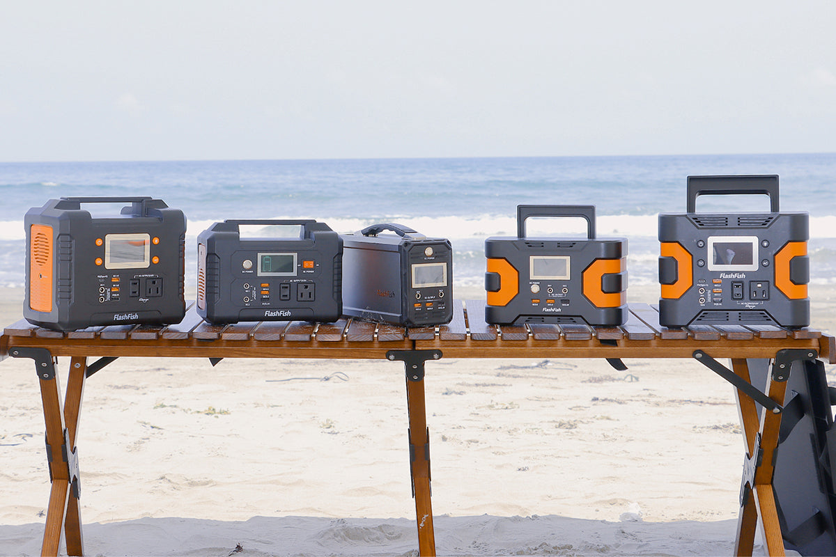 Several FlashFish portable power station models arranged outdoors for comparison