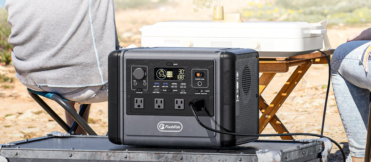 Portable power station with visible front ports on an outdoor equipment case