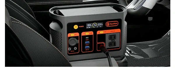 Portable power station positioned inside a vehicle.