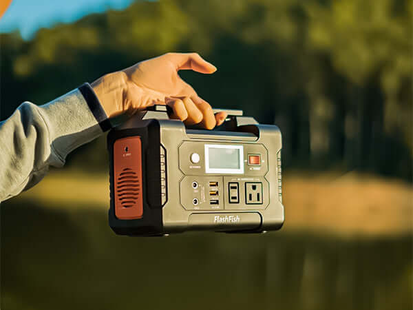 FlashFish E200 being carried across a grassy outdoor area