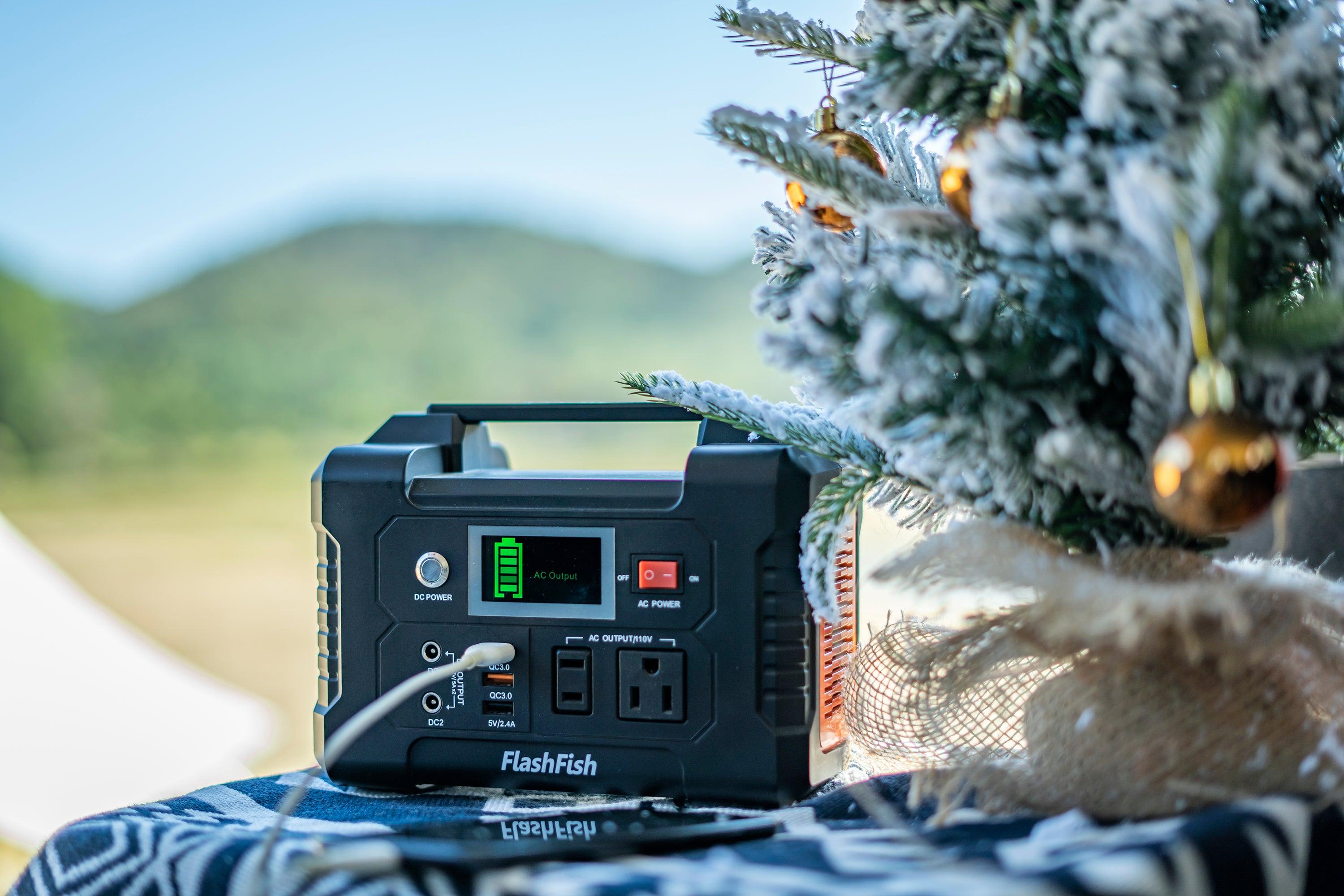 FlashFish portable power station beside a decorated tree