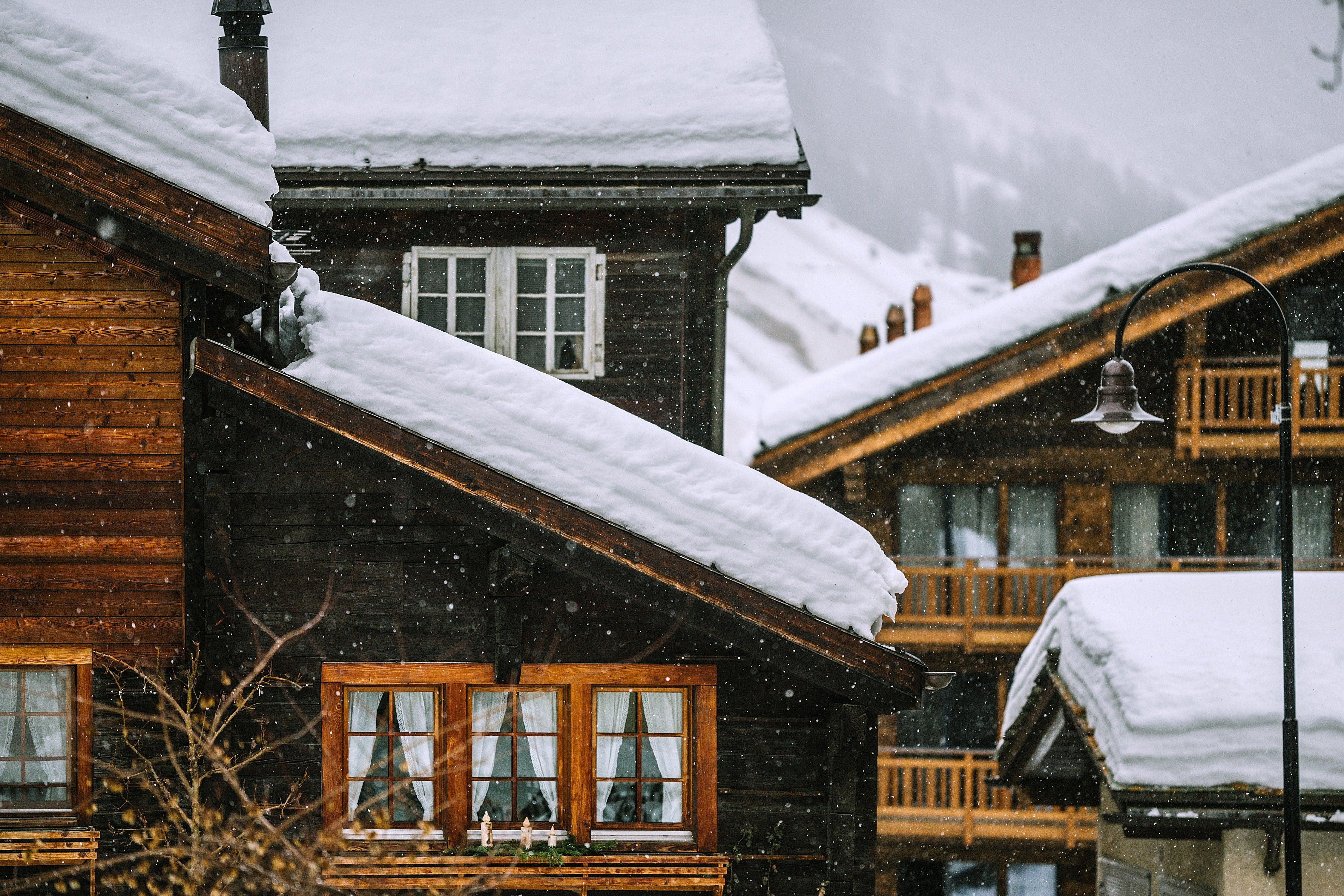 Snow-covered houses during winter snowfall