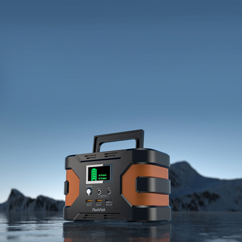 FlashFish portable power station against a blue mountain landscape