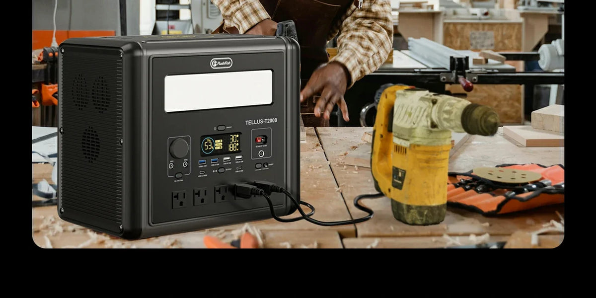 Portable power station beside a drill on a workshop bench