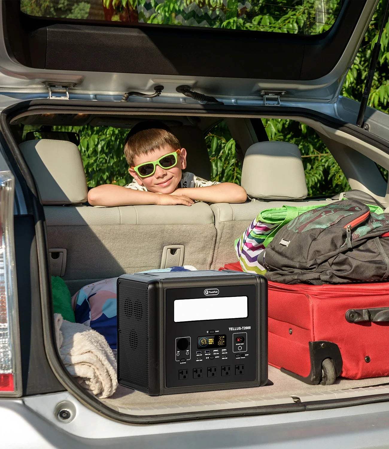 FlashFish T2000 portable power station packed in a vehicle for an outdoor event