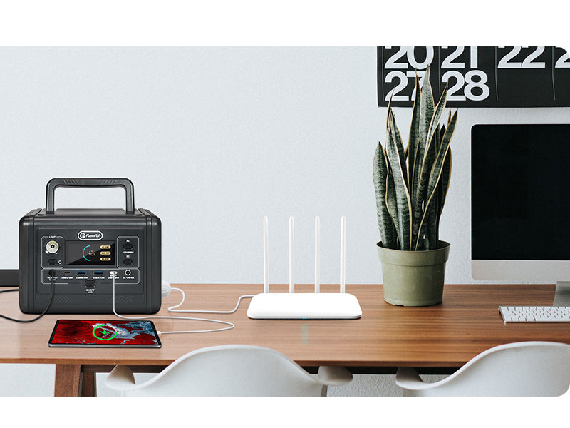 FlashFish T200, a tablet and a router on a home desk.