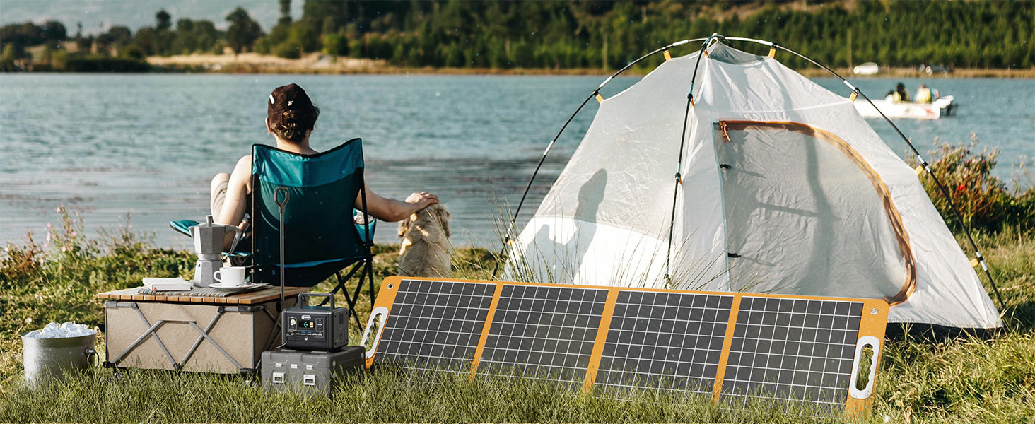 FlashFish portable power station beside a campsite table and tent